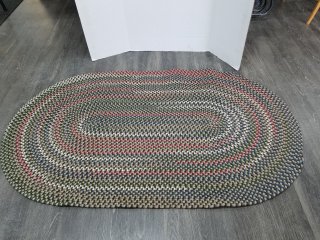 New braided area rug approx 70 by 40 inch 
