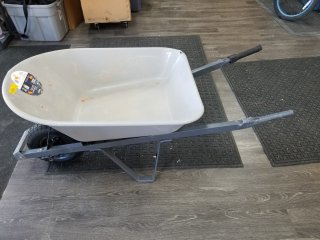 5 cubic foot wheelbarrow, tire great shape, missing 1 handle grip