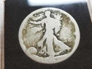 Silver Walking Liberty half dollar, date hard to read 