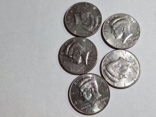 5 Kennedy half dollars 
