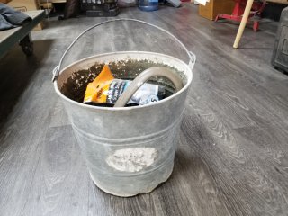 Galvanized pail with misc 