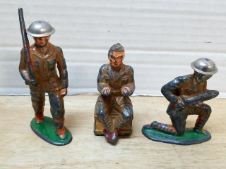 Three Painted Toy Soldiers