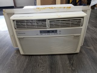 Window air conditioner approx 20 by 16 by 12 inch, works