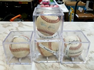 Baseballs in Cases