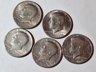5 Kennedy half dollars 