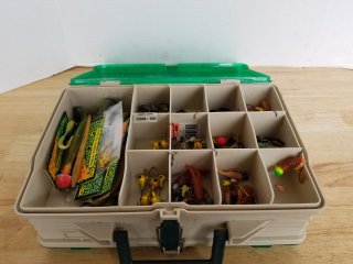 Tackle box with fishing tackle