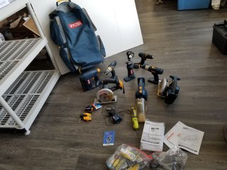 RYOBI cordless tools with manuals and bag