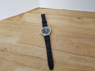 Silver colored Timex watch with black band