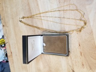 Gold necklace in box