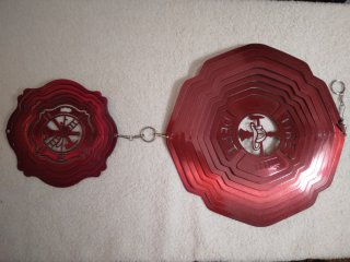 Metal Fireman wind spinner with attachment, like new 