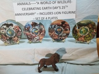 Collectible plate set, mint in boxes, and lion figure 