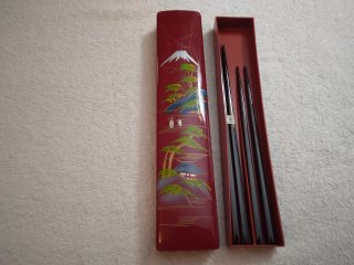 Two sets of chopsticks in handprints plastic container, from Japan