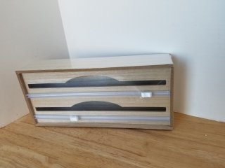 New foil and plastic wrap dispenser,  approx 14 by 6 by 3 inch
