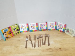 New birthday napkins, forks, knives, books