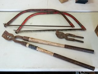 2 Log saws and 2 livestock toe trimmers