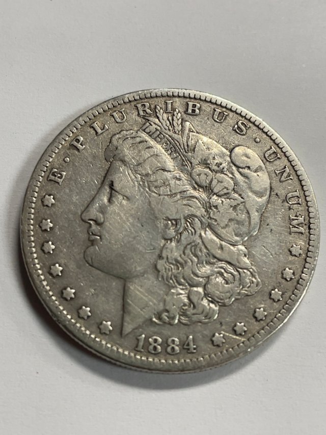 Item #83 — 1884 Morgan Silver Dollar