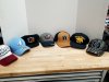 Item #48 — Assorted logo baseball caps
