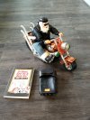 Item #241 — Santa Biker Figurine with Book & Pouch photo 1 of 5