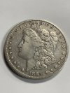 Item #83 — 1884 Morgan Silver Dollar photo 1 of 2