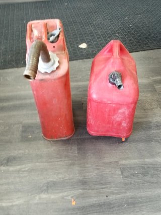 Item #326 — PAIR of gas cans, tallest approx 20 inch photo 1 of 2