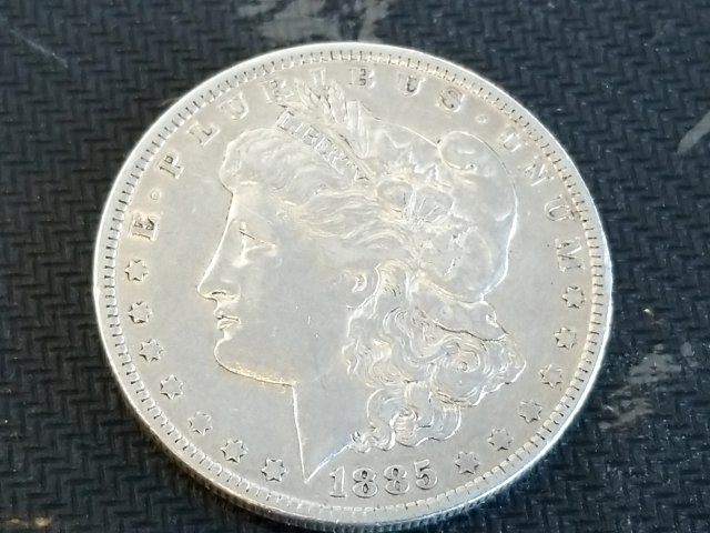 Item #48 — 1885 O Morgan Silver Dollar photo 1 of 2