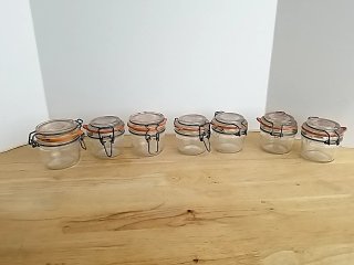 Item #118 — Set of 7 Glass Clamp-Lid Jars photo 1 of 3