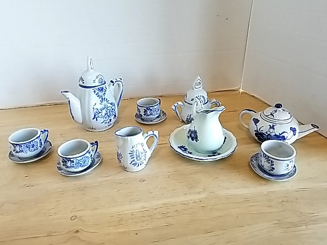 Item #157 — Blue Floral Porcelain Tea Set, tallest approx 4 inch photo 1 of 5