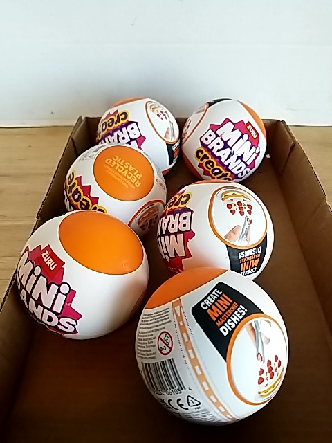 Item #88 — New Mini Brands toy balls in box