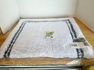 Item #29 — New bath rug 34 by 21 inch