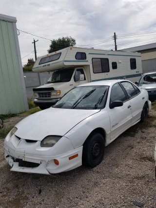 Item #5 — 2001 White Pontiac Sunfire	26-01959