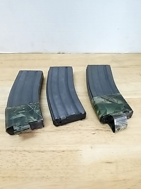 Item #54 — Metal .223 gun clips, each holds 30 rounds photo 1 of 3
