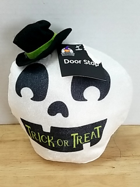 Item #65 — New Halloween Skull Door Stop 6 inch