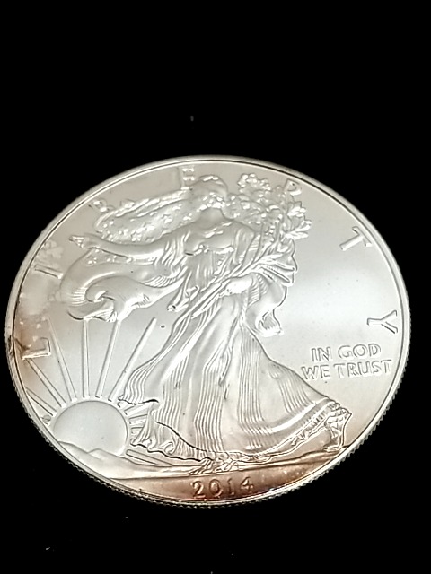 Item #12 — 2014 American Eagle silver dollar photo 1 of 2