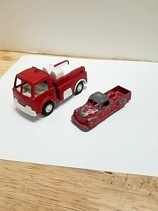 Item #30 — Old toy trucks, largest approx 4 inch photo 1 of 5