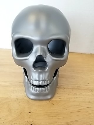 Item #94 — New color changing skull, approx 7 inch tall photo 1 of 2
