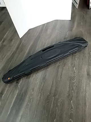 Item #45 — Bushmaster Hard Shell Gun Case Approx 53 inch long
