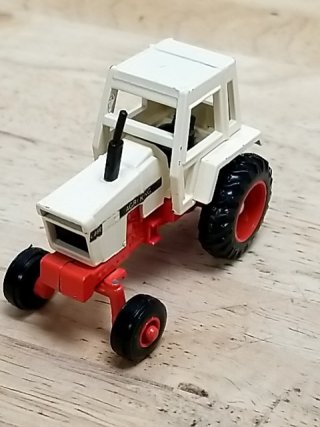 Item #74 — Vintage White Red Toy Tractor approx 2 by 2.5 inch photo 2 of 3