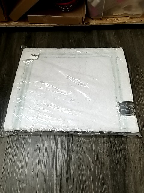 Item #93 — New White Bath Rug 24 by 40 inch photo 1 of 2
