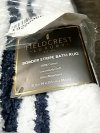 Item #17 — New White Bath Rug with Black Border 34 by 21 inch photo 2 of 2