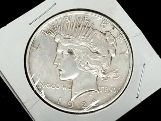 Item #60 — 1922 Peace Silver Dollar Coin photo 1 of 2