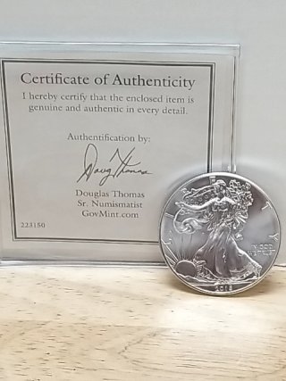Item #40 — 2015 American Eagle Silver Dollar with COA photo 1 of 3