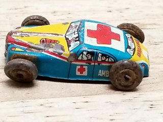 Item #63 — Vintage Toy Ambulance Car 1.5 in photo 1 of 4