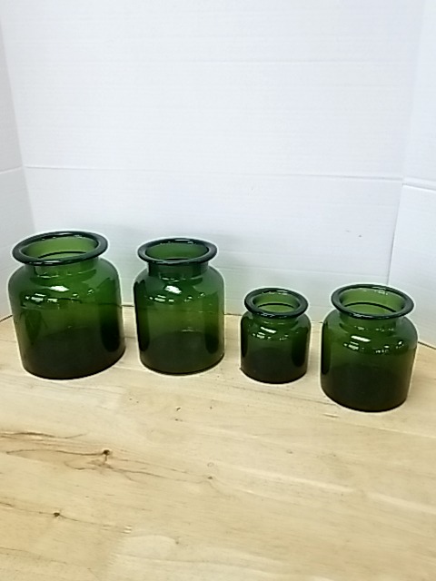 Item #450 — Set of 4 Green Glass Jars Tallest approx 8 inch photo 1 of 3