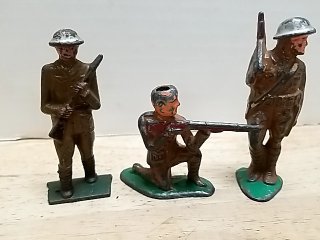 Item #76 — Three Vintage Metal Toy Soldiers 3 in photo 1 of 4