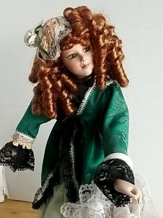 Item #402 — Victorian Porcelain Doll in Green Dress 14 inch tall photo 2 of 3