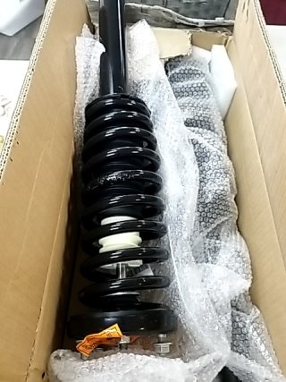 Item #121 — New Black Coilover Strut Assembly photo 1 of 3