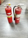 Item #114 — TWO Red Fire Extinguishers Each 10 lb, appear full photo 1 of 4